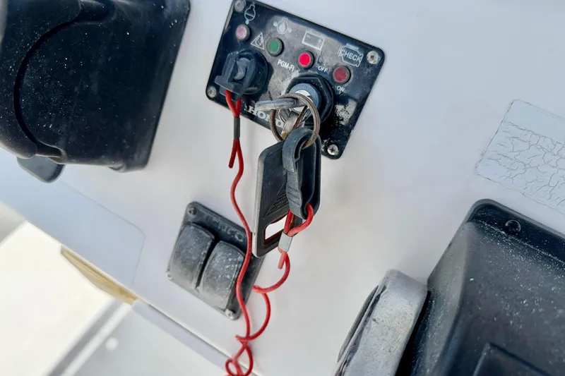 Slide: The Image of Ignition panel of a 2009 Sea Fox 216 Center Console boat with keys inserted. - 22