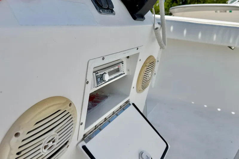 Slide: The Image of 2009 Sea Fox 216 Center Console boat interior with stereo system and speakers. - 23