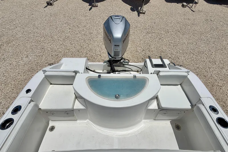 Slide: The Image of 2009 Sea Fox 216 Center Console boat with Honda outboard motor, rear view. - 25