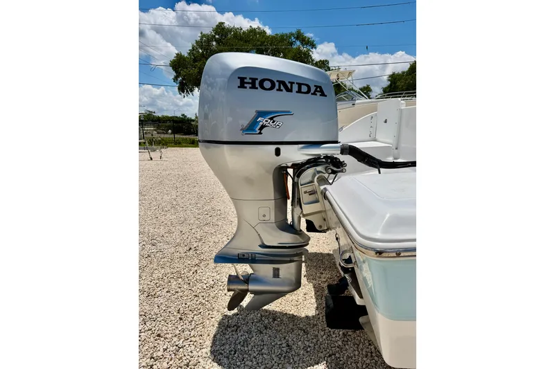 Slide: The Image of Outboard motor on a 2009 Sea Fox 216 Center Console boat, sunny day. - 28