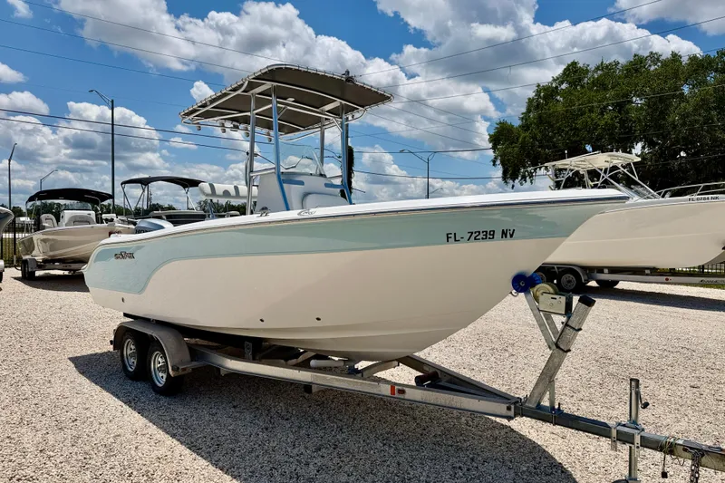 Slide: The Image of 2009 Sea Fox 216 Center Console boat on trailer under a partly cloudy sky. - 3