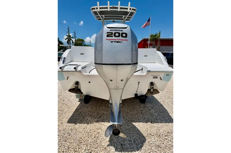 Slide: The Image of Rear view of a 2009 Sea Fox 216 Center Console with Honda 200 outboard motor. - 30