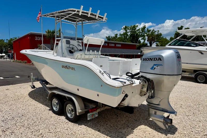 Slide: The Image of 2009 Sea Fox 216 Center Console boat with Honda outboard motor on trailer. - 5