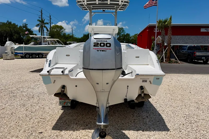 Slide: The Image of 2009 Sea Fox 216 Center Console boat with Honda 200 engine, parked outdoors. - 6