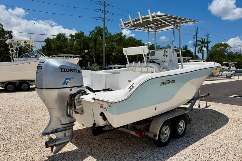 Slide: The Image of 2009 Sea Fox 216 Center Console boat with Honda outboard motor on trailer. - 7