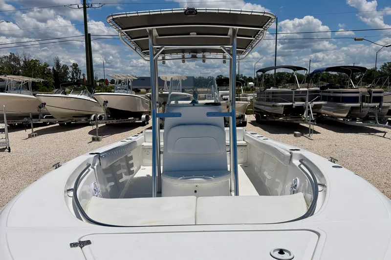Slide: The Image of 2009 Sea Fox 216 Center Console boat displayed in a marina under a blue sky. - 8