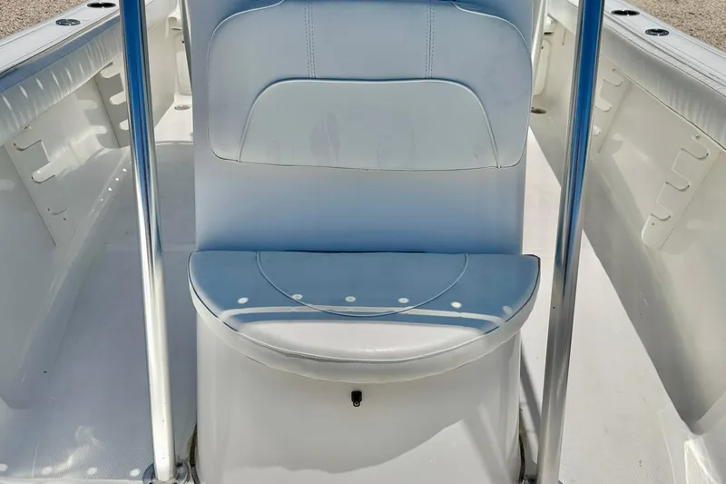Slide: The Image of 2009 Sea Fox 216 Center Console boat interior with white seating and stainless steel rails. - 9