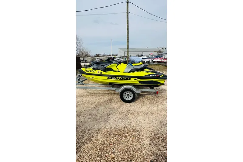 The Image of 2020 Sea-Doo RXT-X 300 jet ski on trailer, yellow. - 0