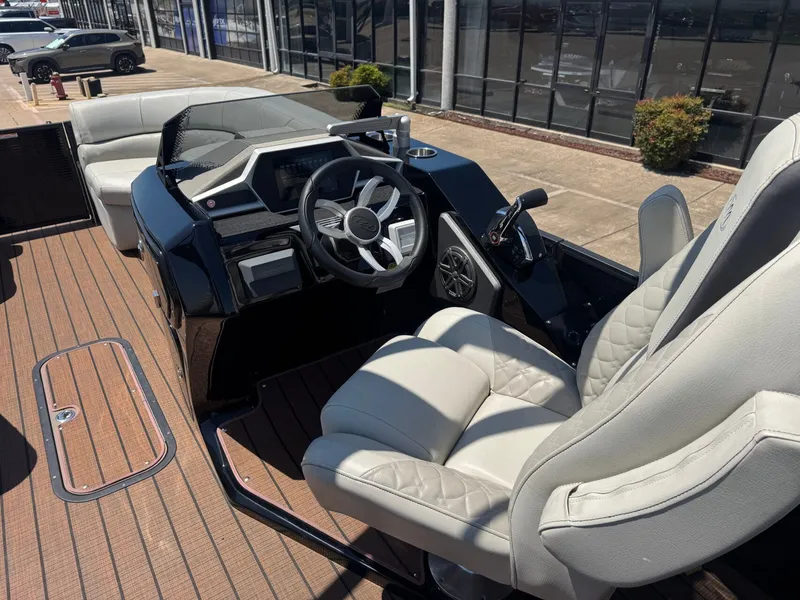 Slide: The Image of Interior of 2024 Manitou 25 LX RFX SHP with luxurious seating. - 10