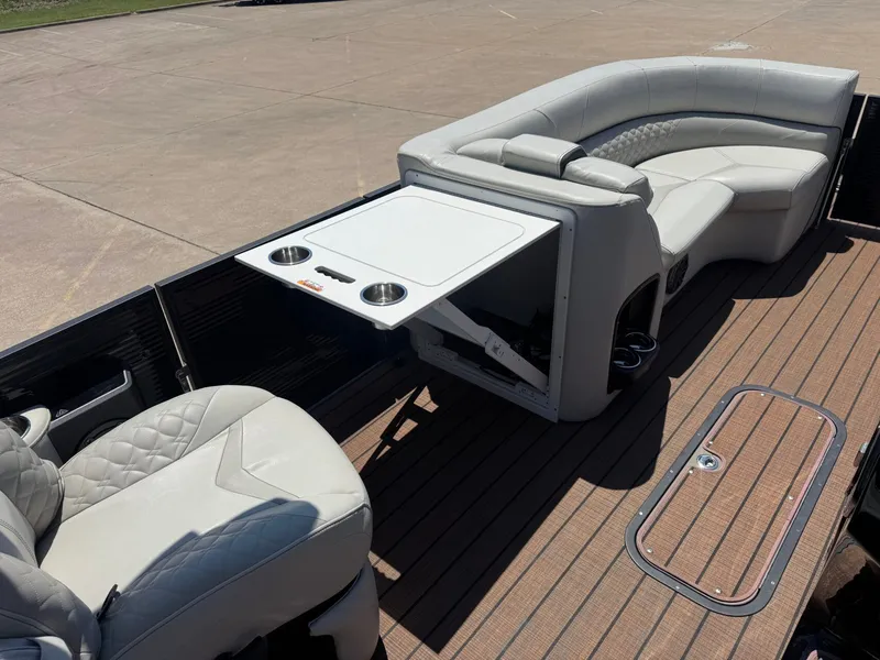 Slide: The Image of Interior of 2024 Manitou 25 LX RFX SHP with seating and table. - 11