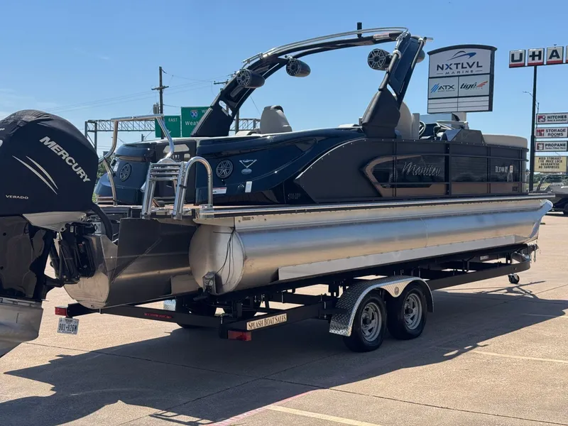 Slide: The Image of 2024 Manitou 25 LX RFX SHP pontoon boat on trailer. - 5