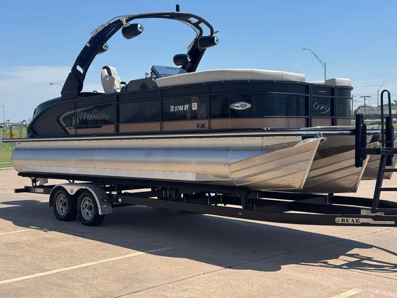 Slide: The Image of 2024 Manitou 25 LX RFX SHP pontoon boat on trailer. - 6