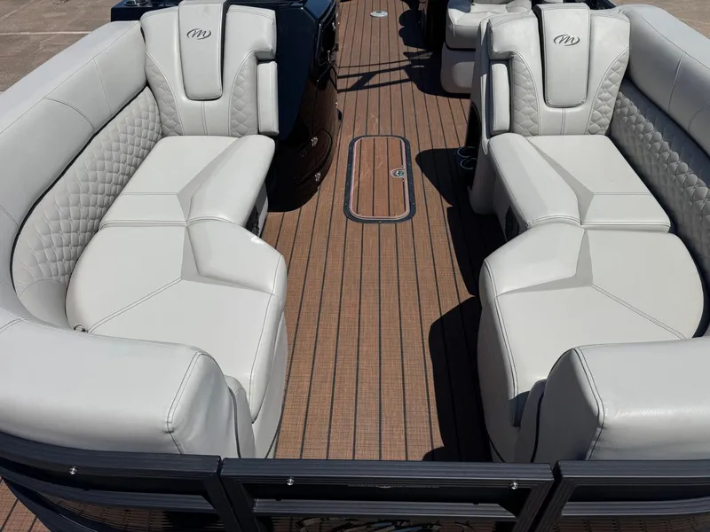 Slide: The Image of Interior of 2024 Manitou 25 LX RFX SHP with luxurious seating. - 7