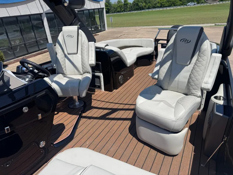 Slide: The Image of Interior of 2024 Manitou 25 LX RFX SHP with luxurious seating. - 8