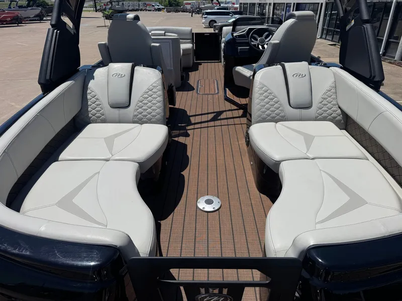 Slide: The Image of Interior of 2024 Manitou 25 LX RFX SHP with luxurious seating. - 9