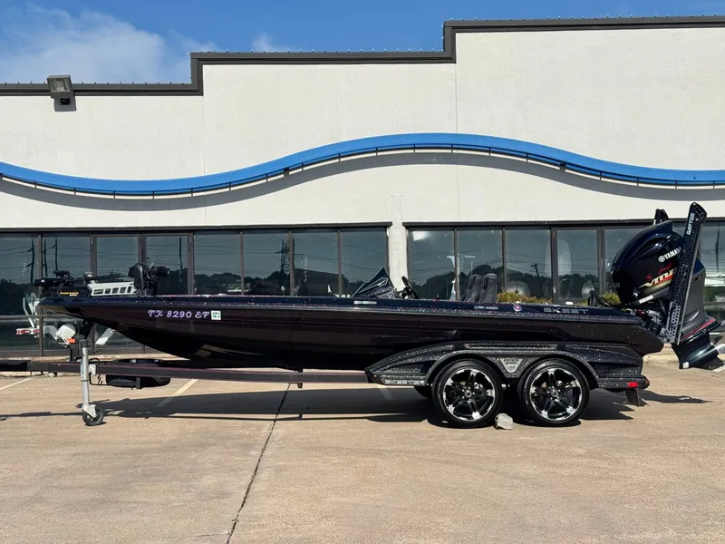 The Image of 2018 Skeeter FX21 boat parked in front of a modern building. - 1
