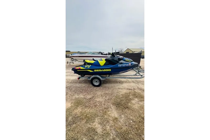 The Image of 2019 Sea-Doo Wake Pro 230 jet ski on trailer, parked outdoors. - 0