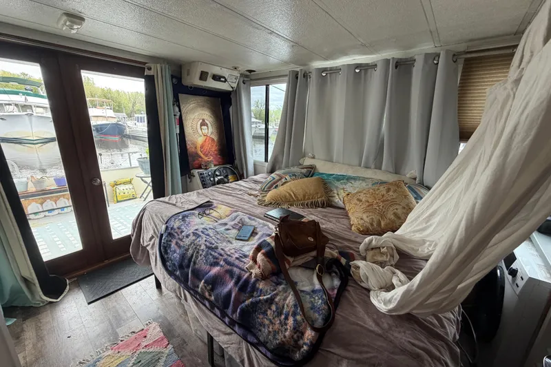 Slide: The Image of Interior of a 1997 Catamaran Cruisers 44' Aqua Cruiser with cozy bedroom setup. - 12