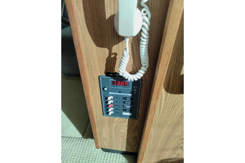 Slide: The Image of Control panel with digital display and switches on a 1978 Bertram 46.6 yacht. - 14