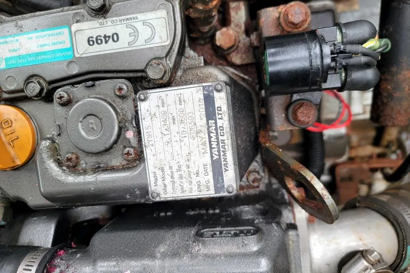 Slide: The Image of Close-up of a Yanmar engine in a 1974 Marshall 22 Catboat. - 15