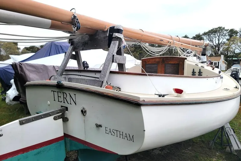 Slide: The Image of 1974 Marshall 22 Catboat "Tern" in Eastham, displayed on land with mast and rigging. - 18