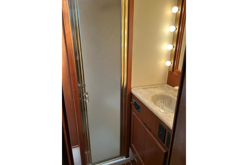 Slide: The Image of Bathroom interior of 1990 Post 46 Convertible yacht with shower and vanity lights. - 10