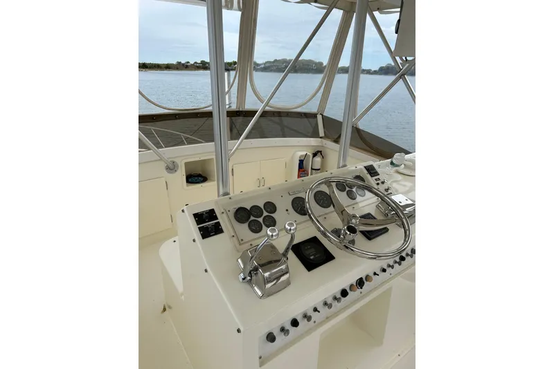 Slide: The Image of Helm of 1990 Post 46 Convertible boat with steering wheel and control panel. - 17