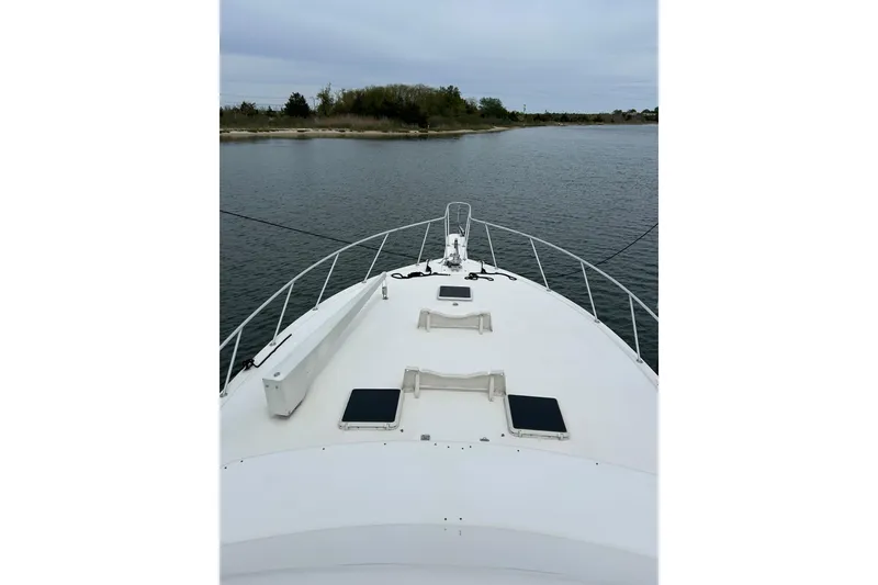 Slide: The Image of Bow view of 1990 Post 46 Convertible yacht on calm waters. - 20