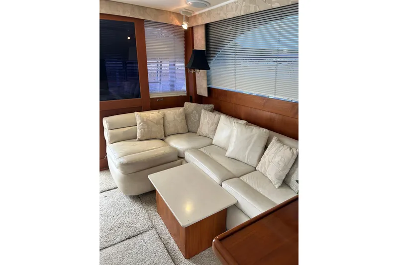 Slide: The Image of Luxurious interior of a 1990 Post 46 Convertible yacht with plush seating and elegant decor. - 4