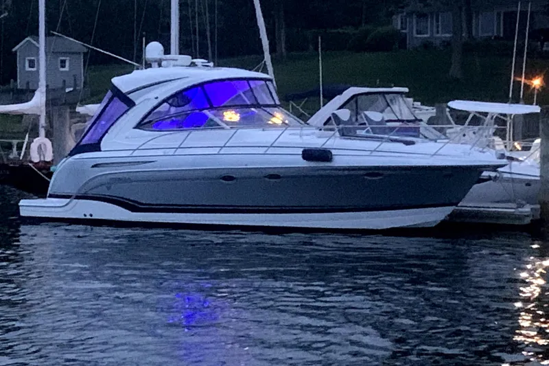 Slide: The Image of 2013 Formula 34 Performance Cruiser docked at marina with illuminated cabin. - 4