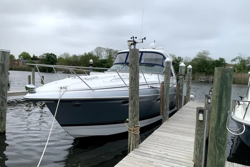 Slide: The Image of 2013 Formula 34 Performance Cruiser docked at a marina, overcast sky. - 6