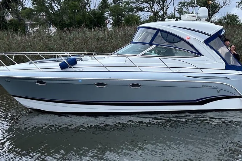 Slide: The Image of 2013 Formula 34 Performance Cruiser on calm water, side view. - 7