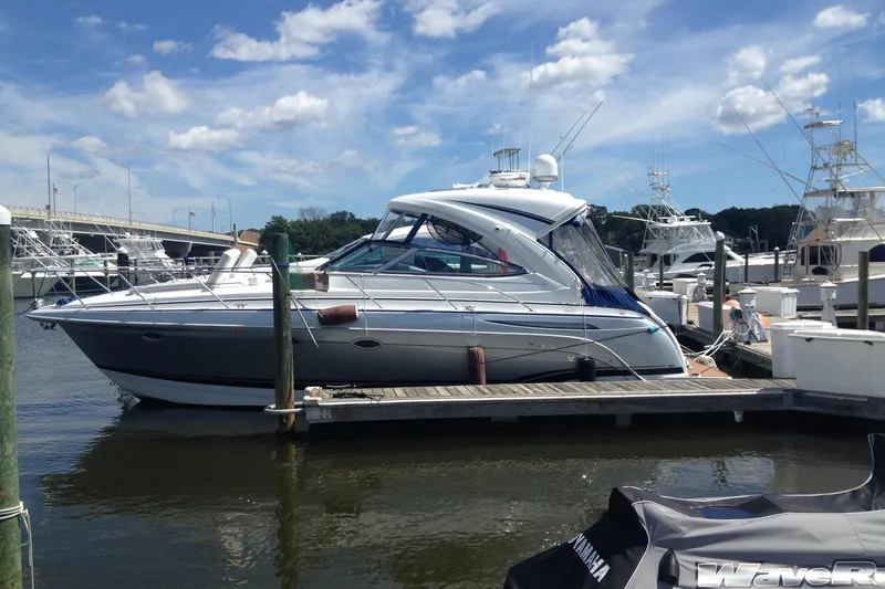 Slide: The Image of 2013 Formula 34 Performance Cruiser docked at marina under blue sky. - 8