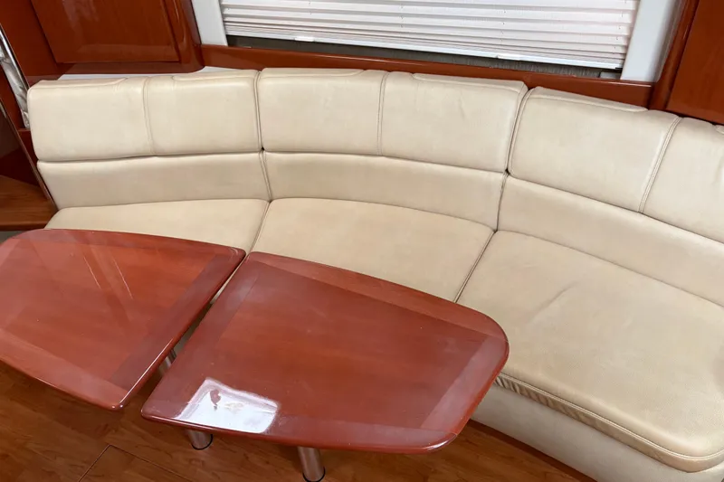 Slide: The Image of Interior of 2013 Formula 34 Performance Cruiser with beige seating and wooden table. - 9