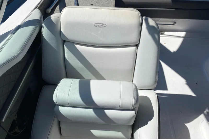 Slide: The Image of White leather seat on 2013 Regal 27 FasDeck RX boat, featuring elegant design and comfort. - 15