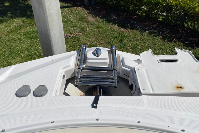 Slide: The Image of Bow of a 2013 Regal 27 FasDeck RX boat with a folded ladder. - 8