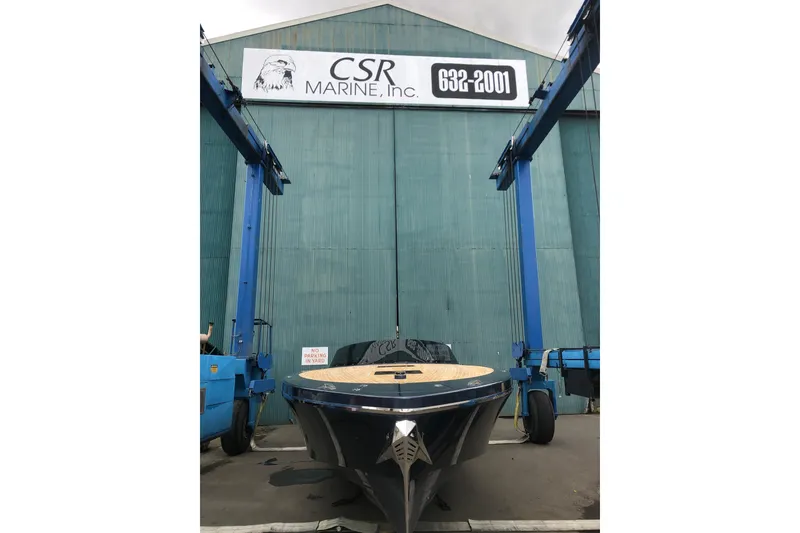 Slide: The Image of 2020 Frauscher 1017 GT boat at CSR Marine facility with blue hoists. - 10
