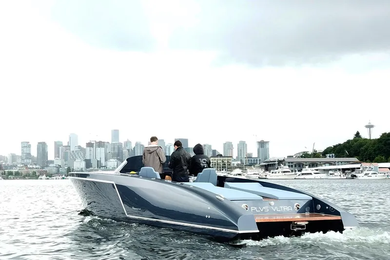 Slide: The Image of 2020 Frauscher 1017 GT boat cruising near city skyline and marina. - 3