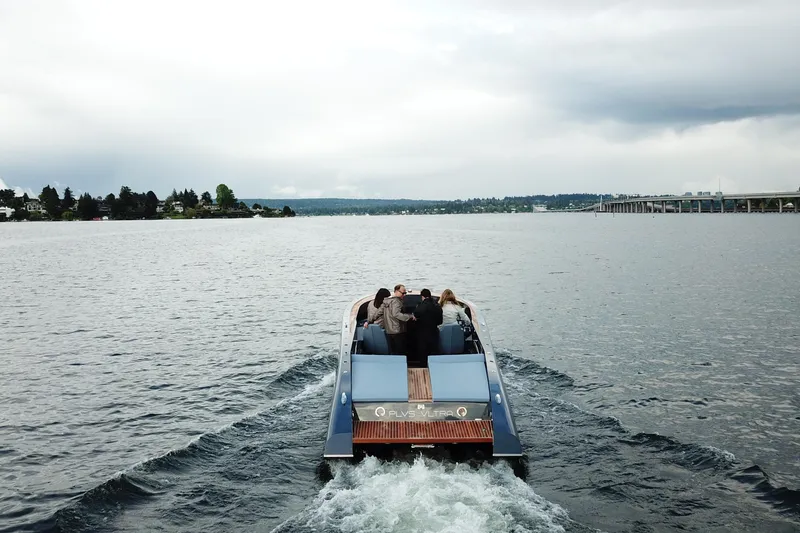 Slide: The Image of 2020 Frauscher 1017 GT cruising on a serene lake under cloudy skies. - 4
