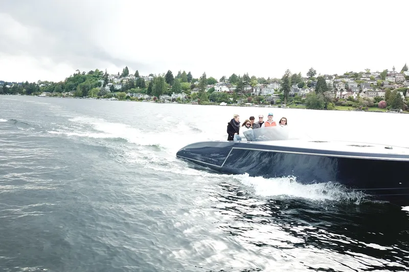 Slide: The Image of 2020 Frauscher 1017 GT cruising on a scenic lake with passengers onboard. - 5