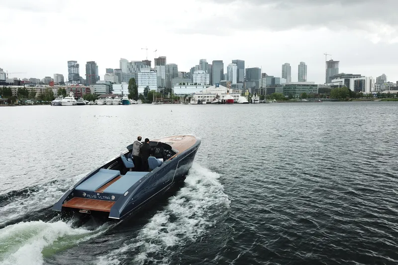 Slide: The Image of Luxury Frauscher 1017 GT boat cruising near city skyline, 2020 model. - 7