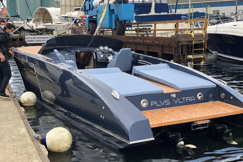 Slide: The Image of Luxury 2020 Frauscher 1017 GT yacht docked at a marina, showcasing sleek design and elegance. - 8