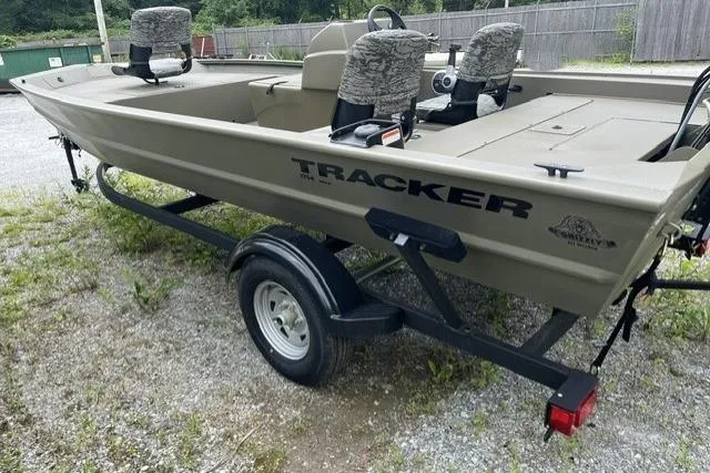 Slide: The Image of 2026 Tracker Grizzly 1754 SC boat on trailer, parked outdoors. - 3