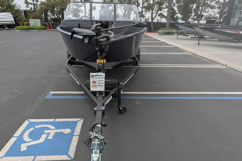 Slide: The Image of 2026 Tracker Pro Guide V-175 WT boat on trailer in parking lot. - 5
