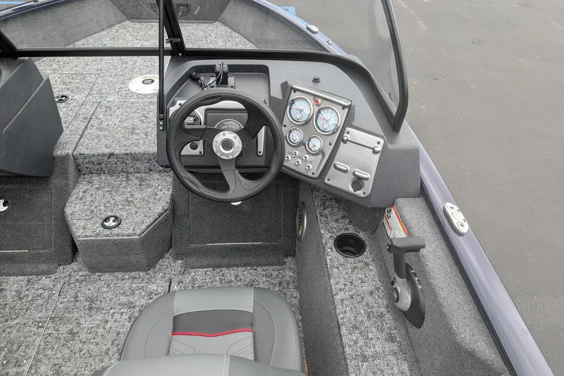Slide: The Image of Interior of 2026 Tracker Pro Guide V-175 WT boat with steering wheel and dashboard. - 8