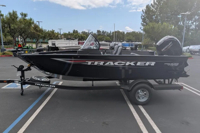 Slide: The Image of 2026 Tracker Pro Guide V-175 WT boat on trailer in parking lot. - 3