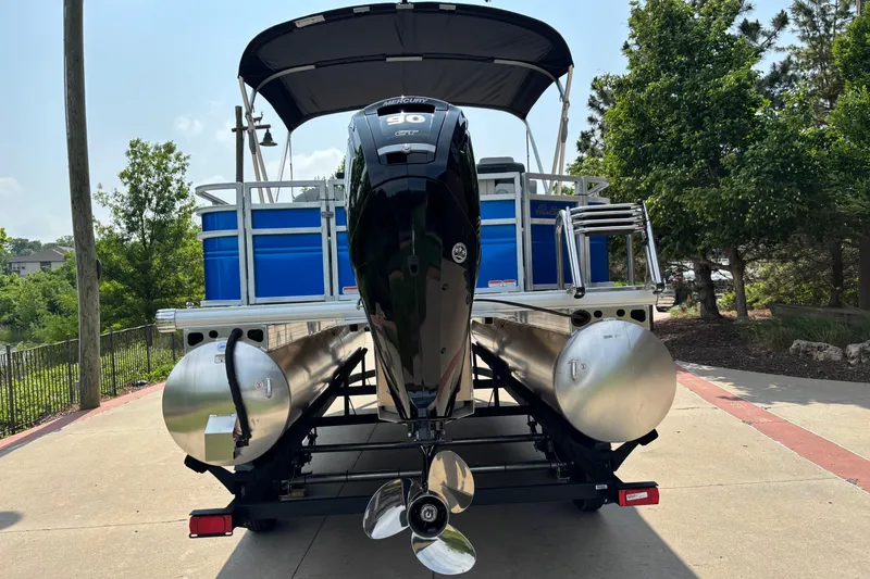 Slide: The Image of 2026 Sun Tracker Fishin' Barge 20 DLX pontoon boat with Mercury outboard motor. - 1