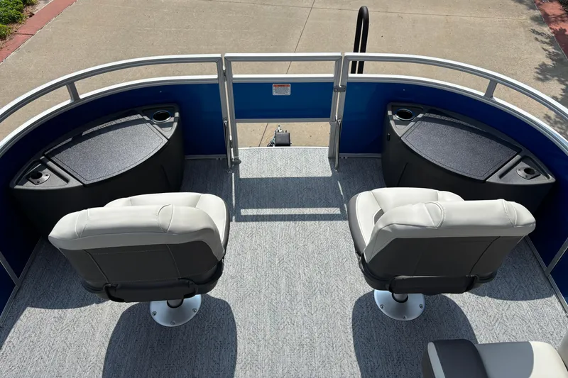 Slide: The Image of 2026 Sun Tracker Fishin' Barge 20 DLX with two swivel seats and storage compartments. - 3