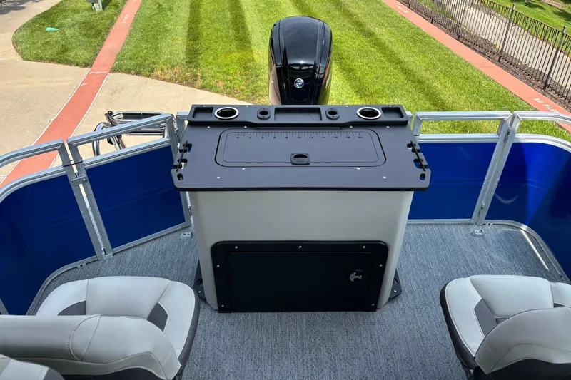 Slide: The Image of 2026 Sun Tracker Fishin' Barge 20 DLX interior with seating and control panel. - 5