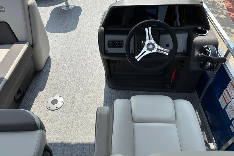 Slide: The Image of Interior view of 2026 Sun Tracker Fishin' Barge 20 DLX boat cockpit. - 6
